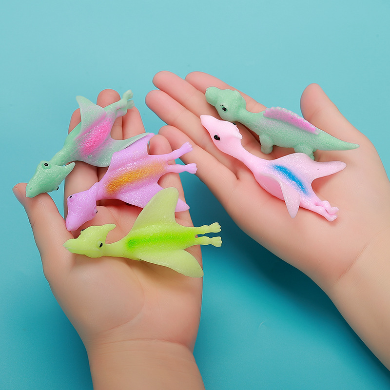 2024 Hot selling New Mini Funny Playful Catapult Flying Squeeze Dino sling shot dino TPR Slingshot Dinosaur Toy