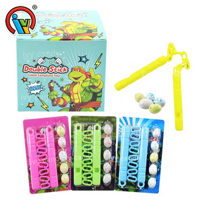 China factory interesting nunchakus toy with puffed chocolate candy