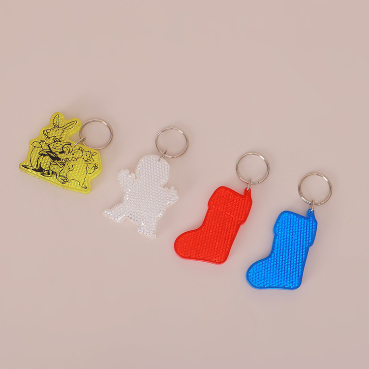 Customized brand logo cute cartoon plastic reflective keychain