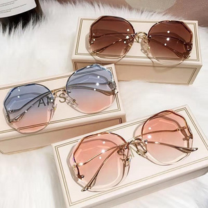 China Luxury New Metal Rimless Rimmed Lady Sun Glasses Lentes de sol Shades Eyewear Custom Designer Unisex Sunglasses