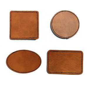 Custom DIY Embossed Debossed Brand Name Logo Round PU Leather Label Leather Patches For Jeans Hat Bag Garment Tags