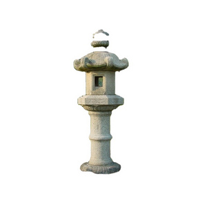 Natural japanese garden stone and cast iron lantern for outdoor