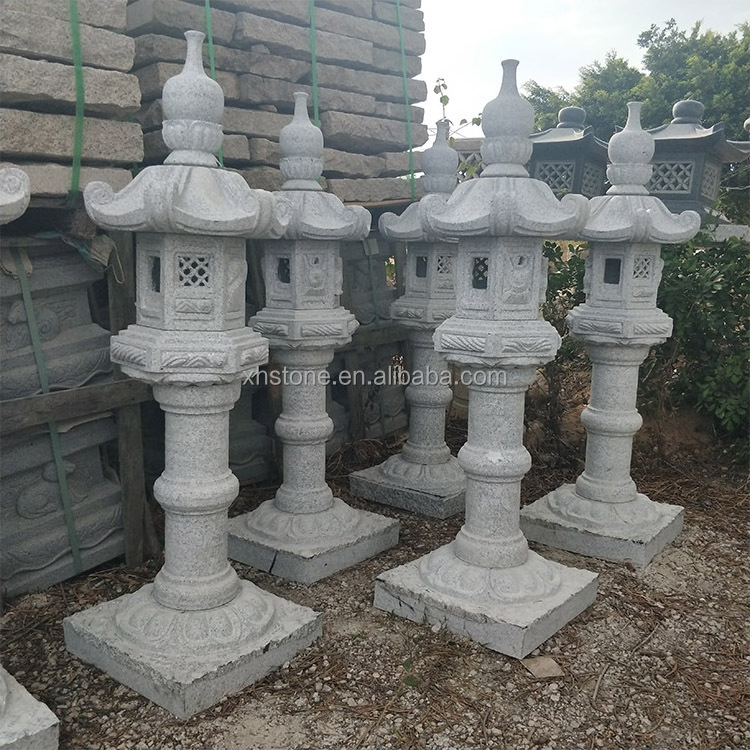 Natural japanese garden stone and cast iron lantern for outdoor