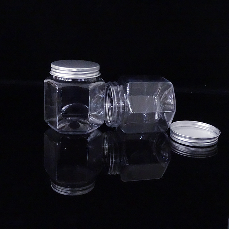 Empty food grade clear PET plastic hexagon jars for honey packaging