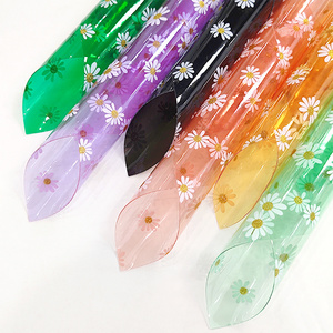 30*135 gauge each roll of colored large Daisy transparent pvc material is used to make raincoat makeup bag toys