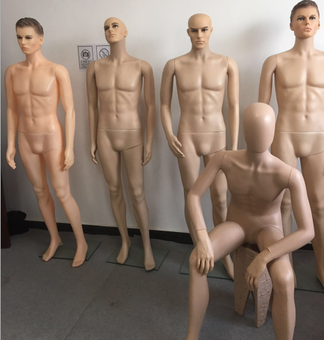 plastic man mannequin in skin color with lifelike head