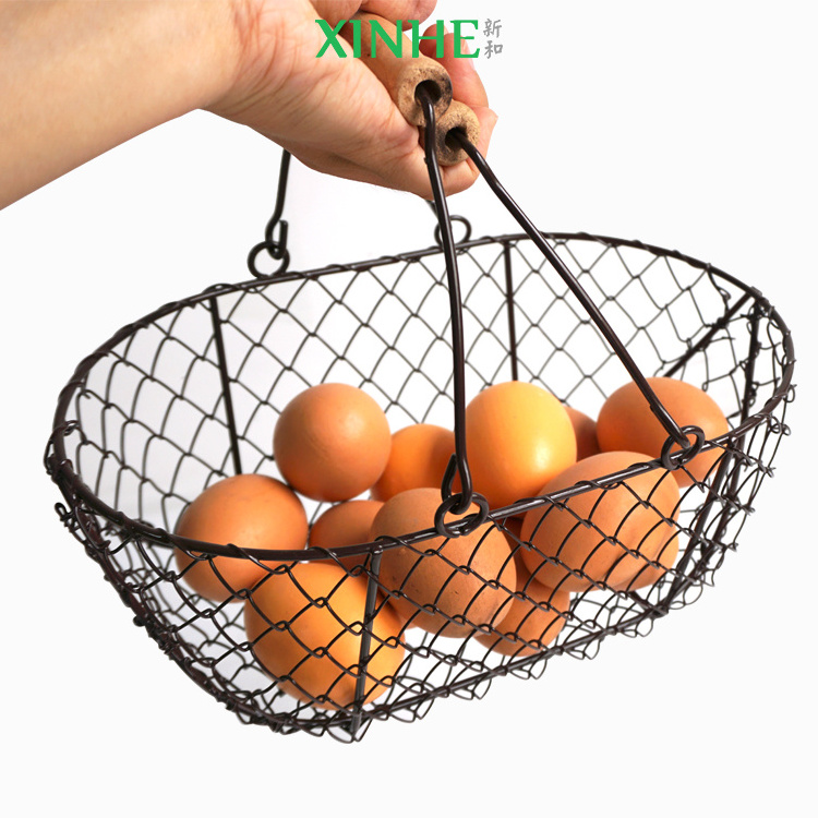 XH wholesale mini size folk art farm home durable black wire iron chicken egg storage basket with wood handle