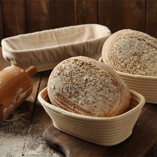 XH Wholesale Factory Handmade OEM Oval Natural Rattan Home Storage Bread Proofing Basket with liner baking tools