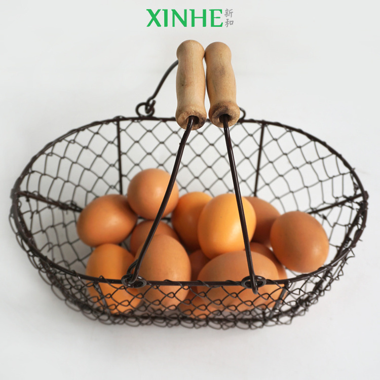 XH wholesale mini size folk art farm home durable black wire iron chicken egg storage basket with wood handle