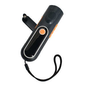 Hand winding/crank dynamo flashlight/torch with FM radio