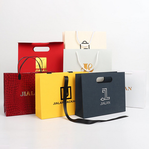 custom luxury black gift clothing garment paper retail carry bags package bolsa de papel packaging brown kraft paper with logo