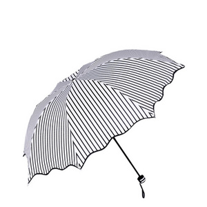 Stylish black and white striped ruffled portable umbrella