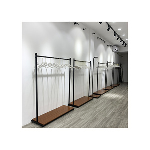 Kainice Customized Freestanding Industrial Pipe Metal Garment Display Stand Clothes Rack for Clothing Store