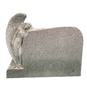 Gray granite  hand carving angel against upright grave stone headstone