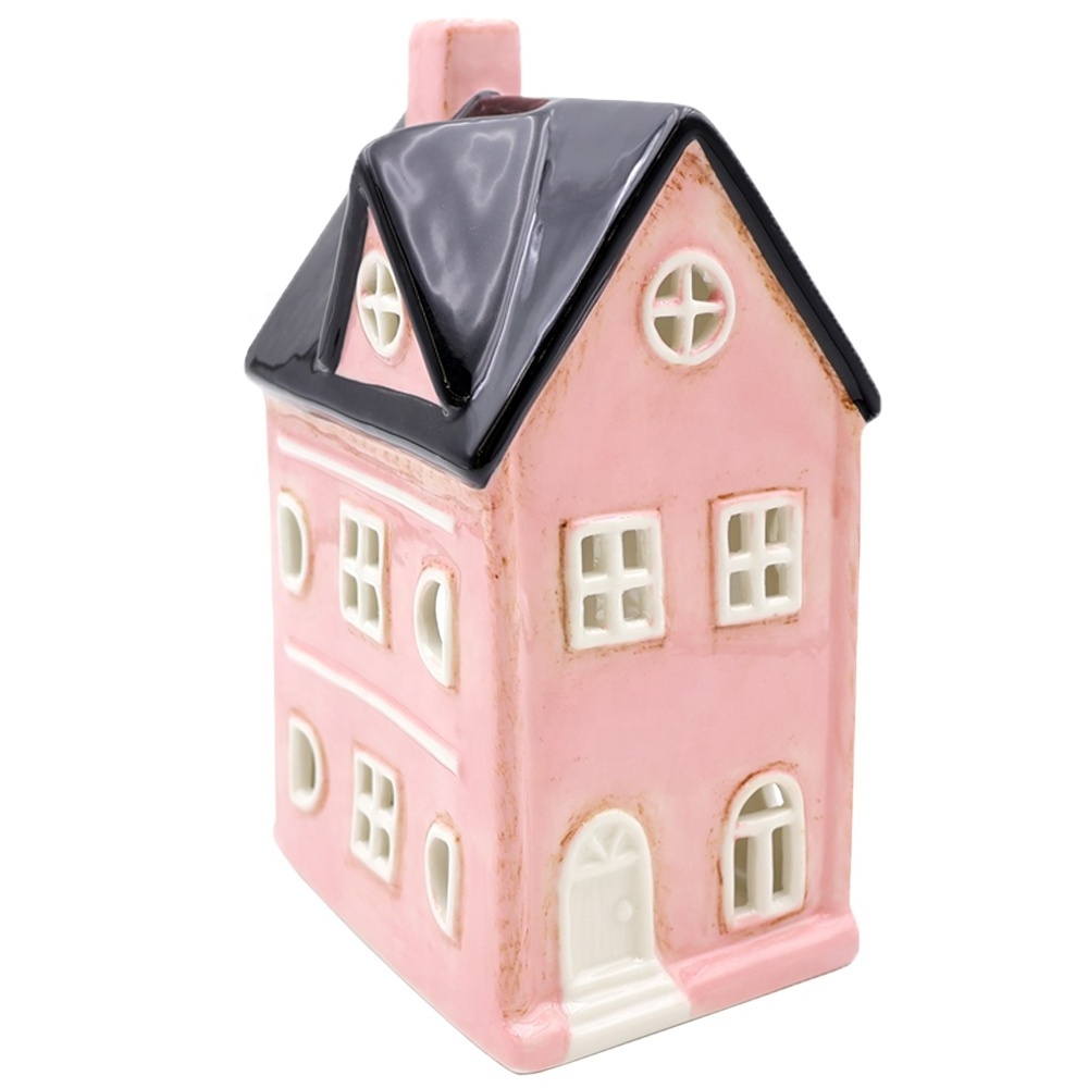 Custom home decor porcelain black and pink hollow-out carved house candle lantern jar leaky ceramic tea light candle holders