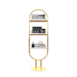 Customized makeup beauty products brand logo metal gold frame high design cosmetic shelves for shops