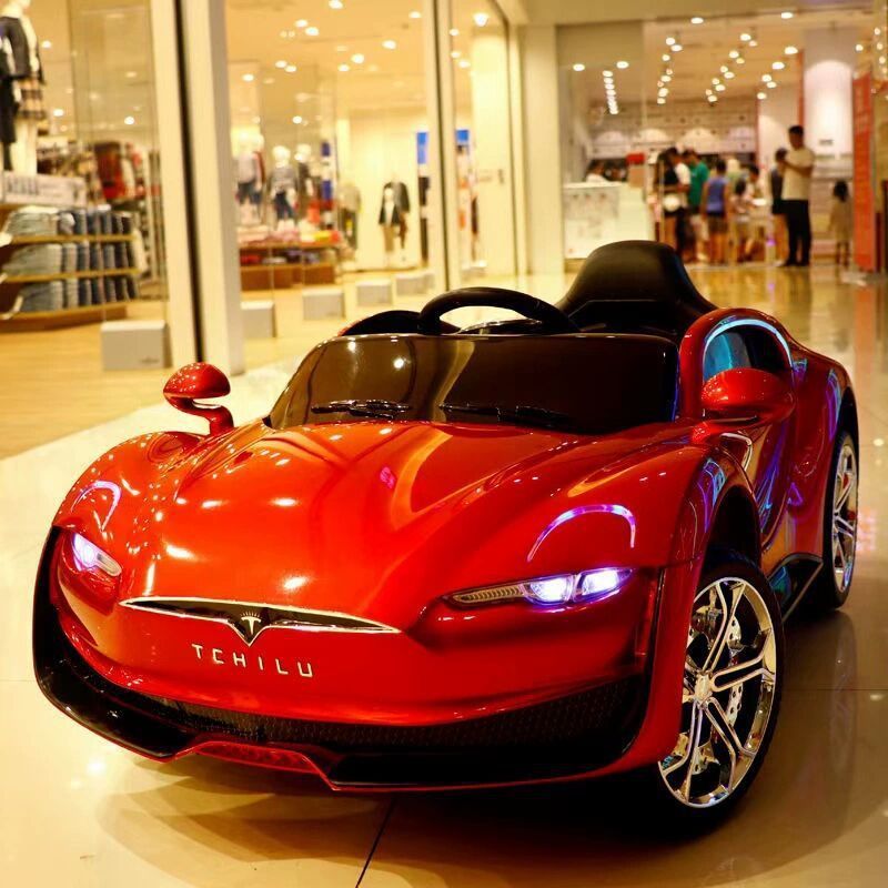 Tesla children's electric vehicle, four-wheel remote control car, can sit four-wheel drive toy electric scooter