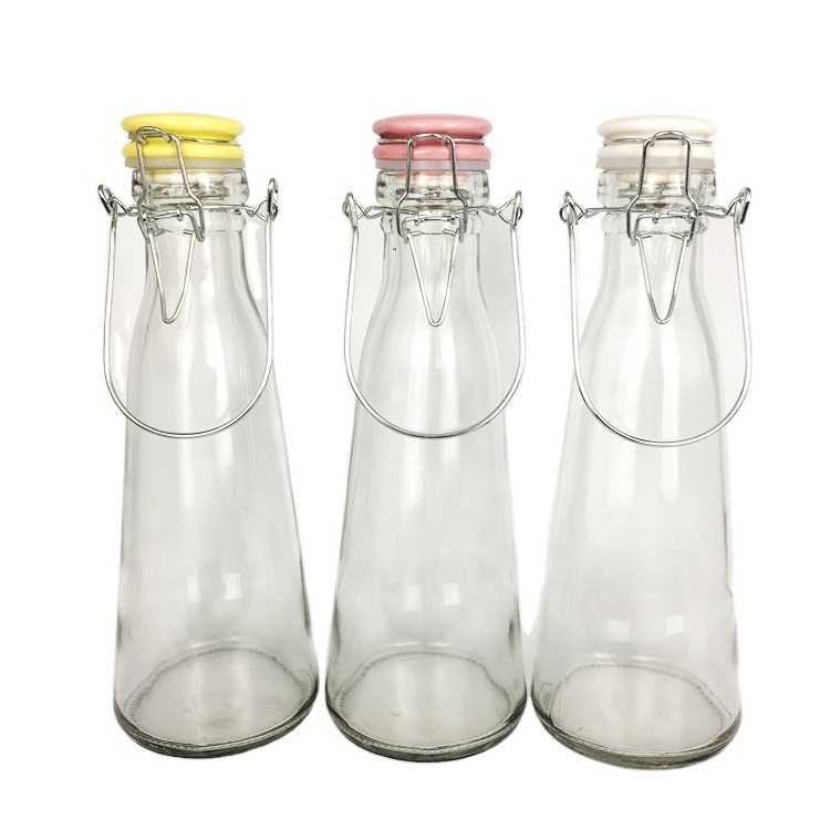 Wholesale 500ml cone clear glass beverage bottle with colored ceramics swing top lid