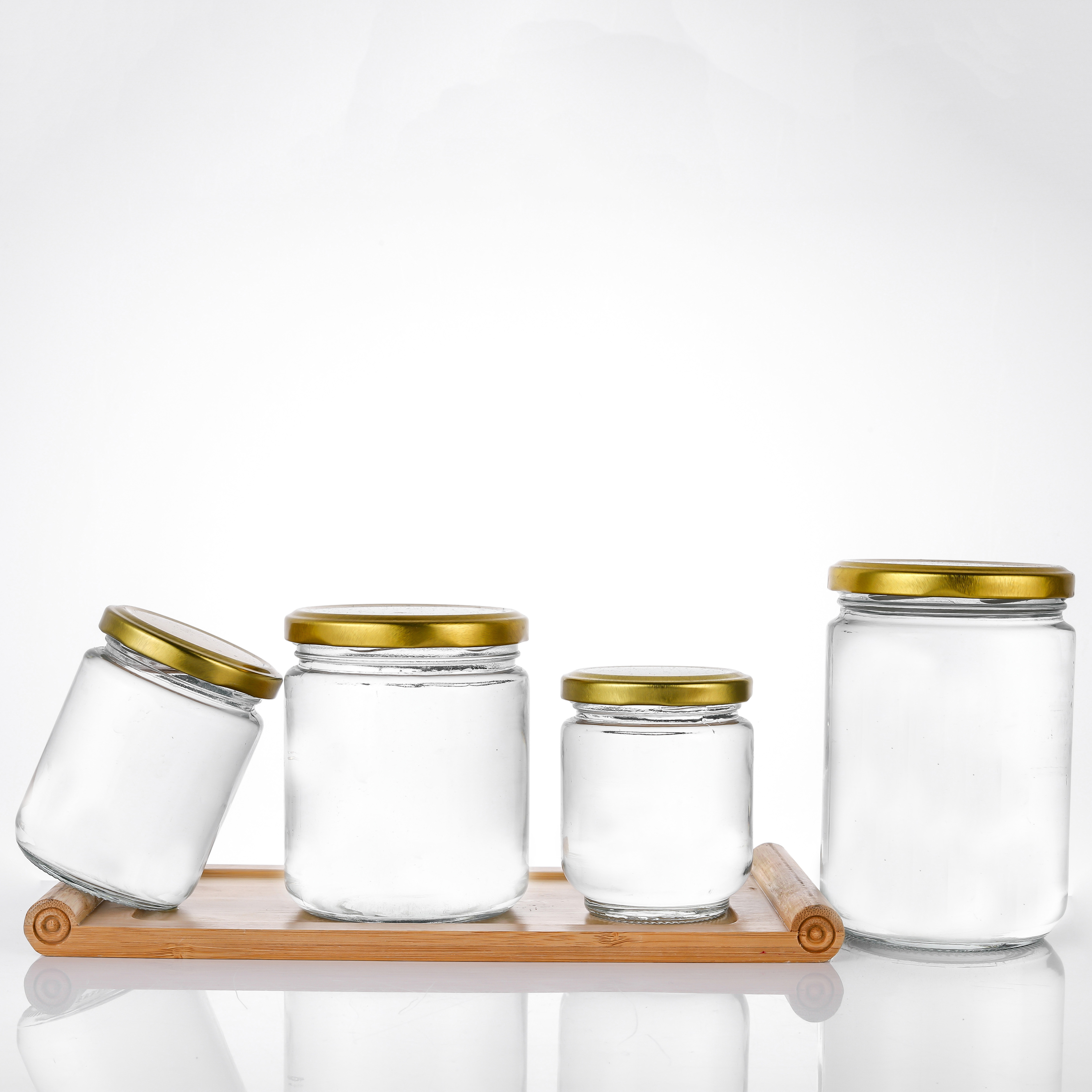 Factory supply 5oz 8oz 12oz 17oz empty clear candy round containers glass jars in bulk with gold metal lids