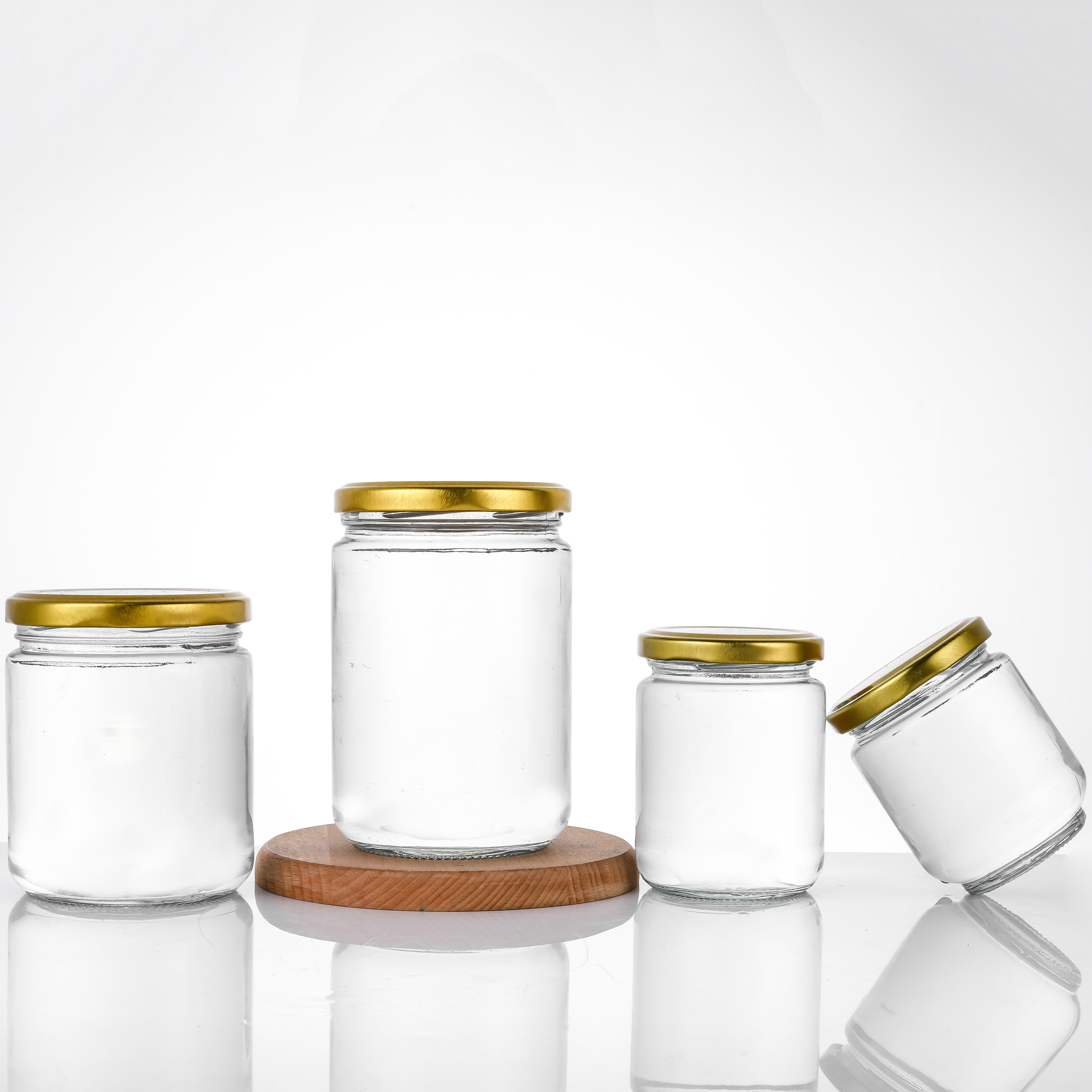 Factory supply 5oz 8oz 12oz 17oz empty clear candy round containers glass jars in bulk with gold metal lids