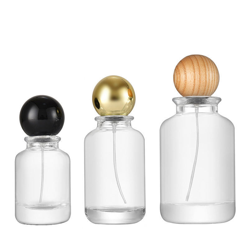 Custom Wholesale 50 ml 30 ml 100 ml Perfume Bottle empty with Wooden Lid Round Clear Perfume Glass Bottles