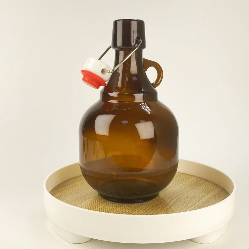 Wholesale 34oz Round Water Kombucha Amber Glass Wine Beer Growler Half Gallon Jugs Bottles With Buckle Rubber Stopper