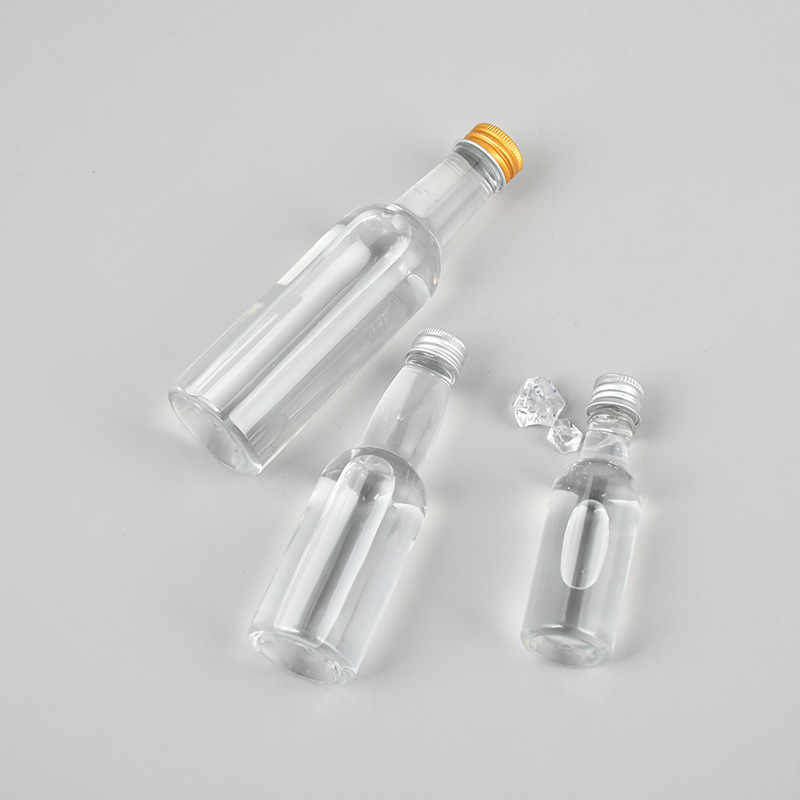 wholesale custom empty 30ml 50ml 100ml alcohol mini whisky liquor bottles small XO wine vodka glass bottle with screw caps