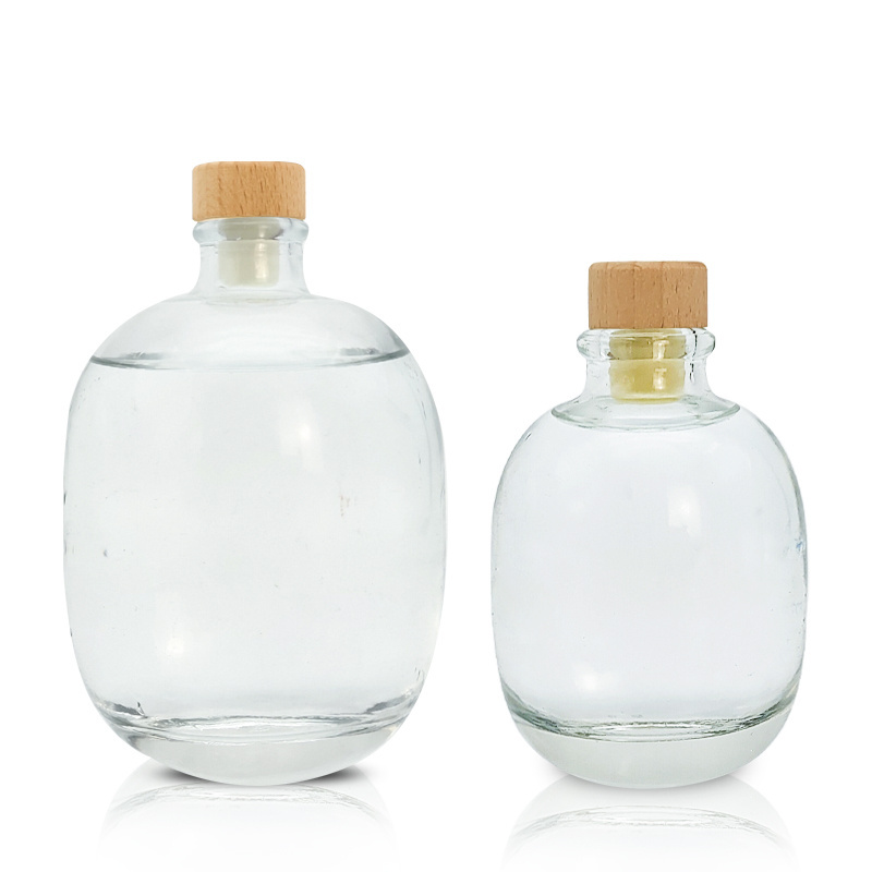 High quality 100ml 250ml 500ml empty clear round glass beverage whiskey vodka wine bottle with bamboo cork cap