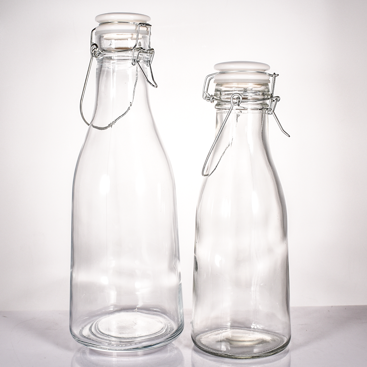 Supplier Custom 1500ml 1.5L Clear Ceramic Swing Open Lids Stopper Glass Juice Kombucha Bottle with hinged handle