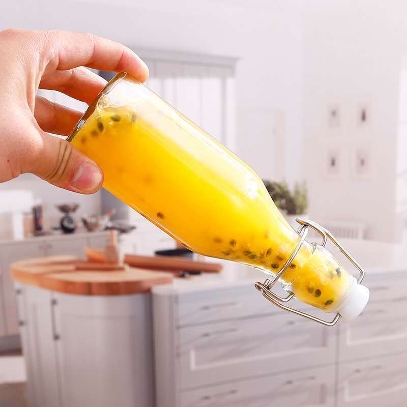 High quality 250ml 500ml 1000ml amber clear swing top flip top kombucha glass beer bottles round glass bottle with flip top