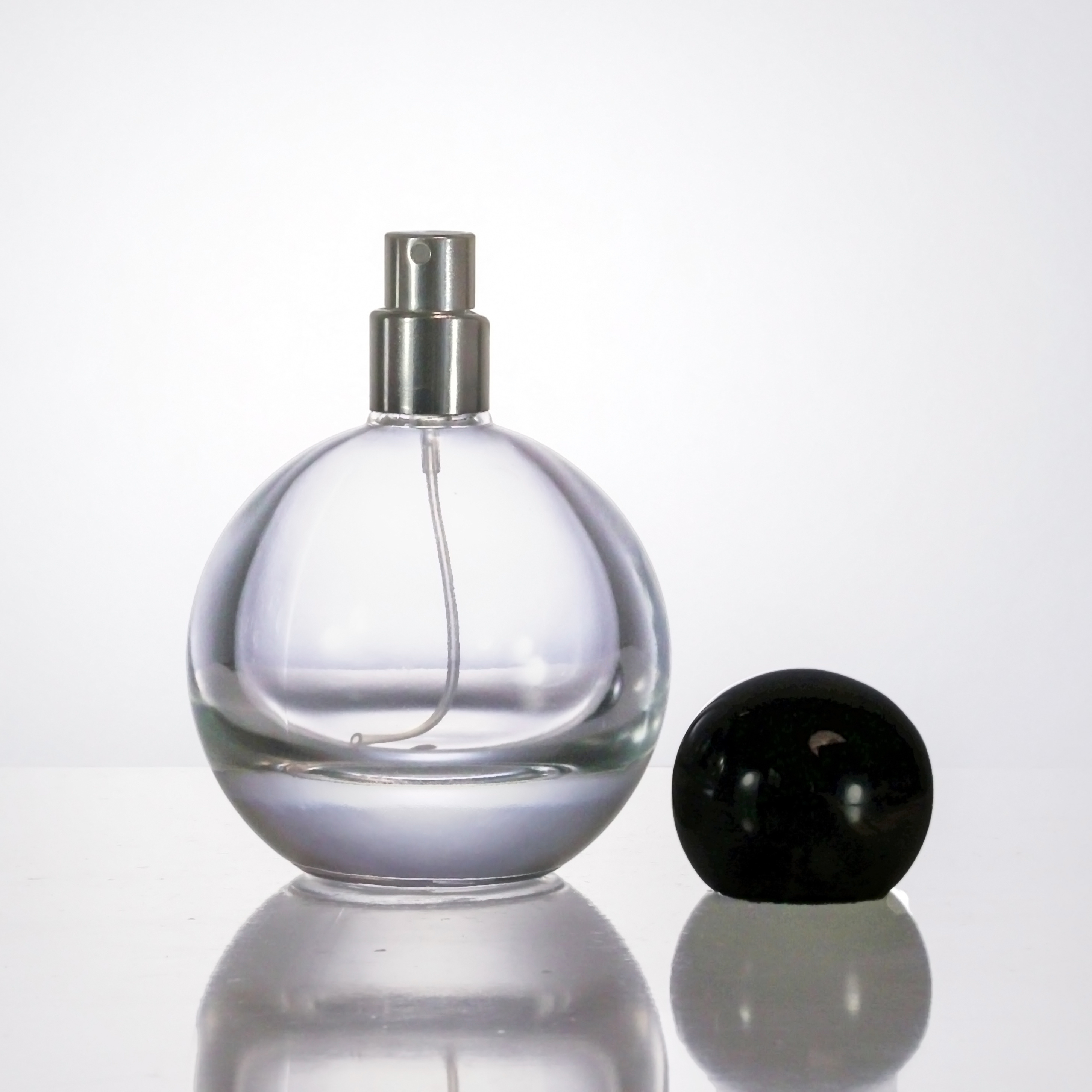 Unique Round Sphere Shaped Trigger Spray Bottle Luxury Modern Perfume Bottle with SPHERICAL CAP