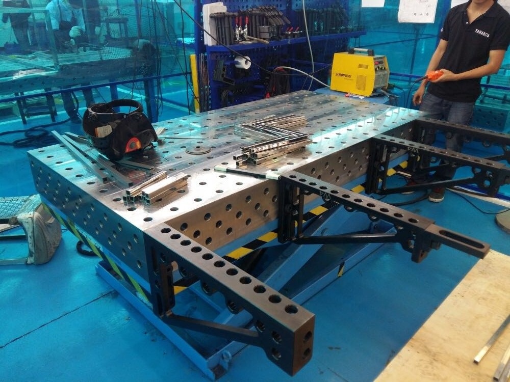 3D Welding Table with Heavy Duty Hydraulic Scissor Lifter for Changing Working Height of High Steel Structures Easily