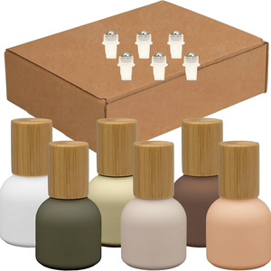 Wholesale New design wooden cap frosted glass roller bottle 10ml bamboo cosmetic packaging bottle