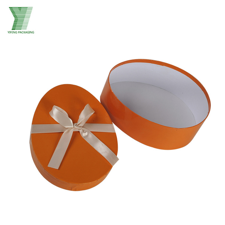 Lid and bottom cute small decorative oval packaging box for chocolate custom two pieces paperboard egg shaped box with ribbon