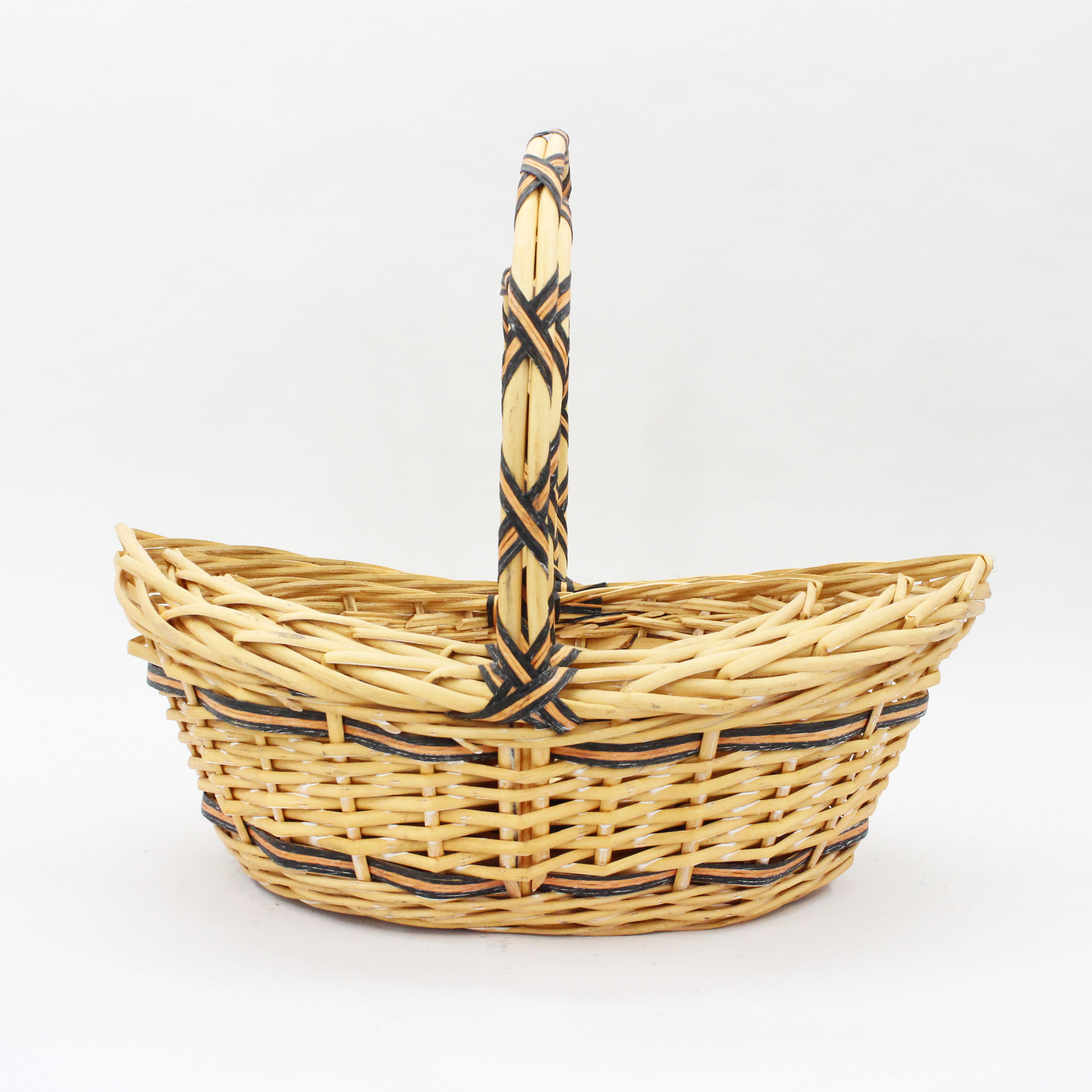 Caramel colored boat shaped handmade wicker woven flower basket storage basket