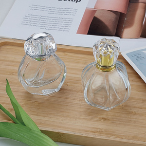 Factory direct sales 35ml100ml Christmas pumpkin shape clear glass perfume 100ml pressure flower bottle acrylic bottle cap