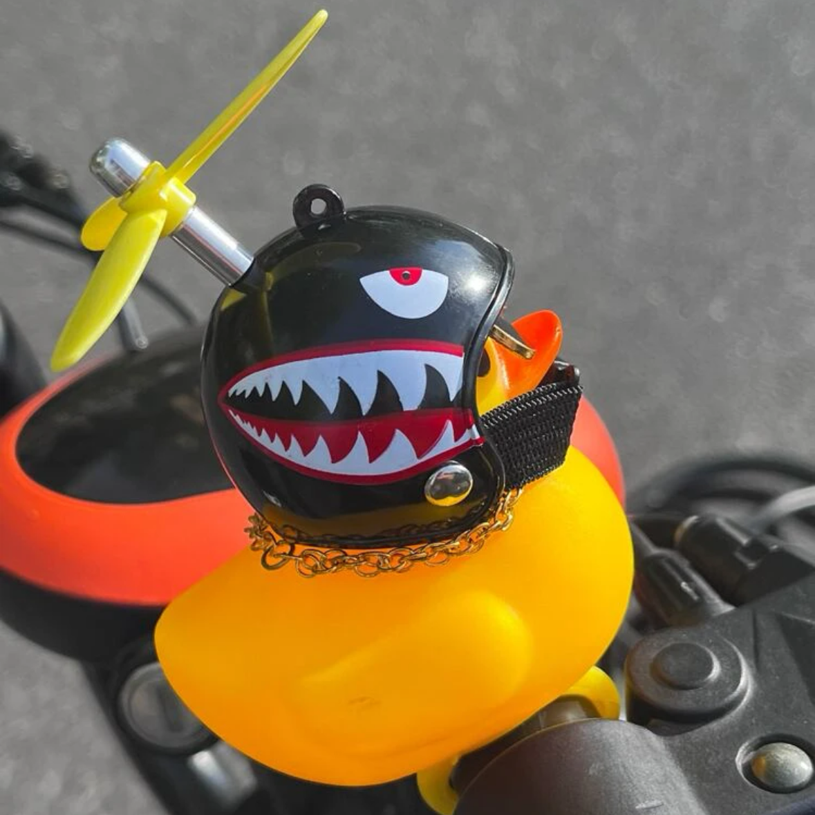 Squeeze will ring small Yellow Duck car electric motorcycle bamboo dragonfly helmet small Yellow duck interior decoration