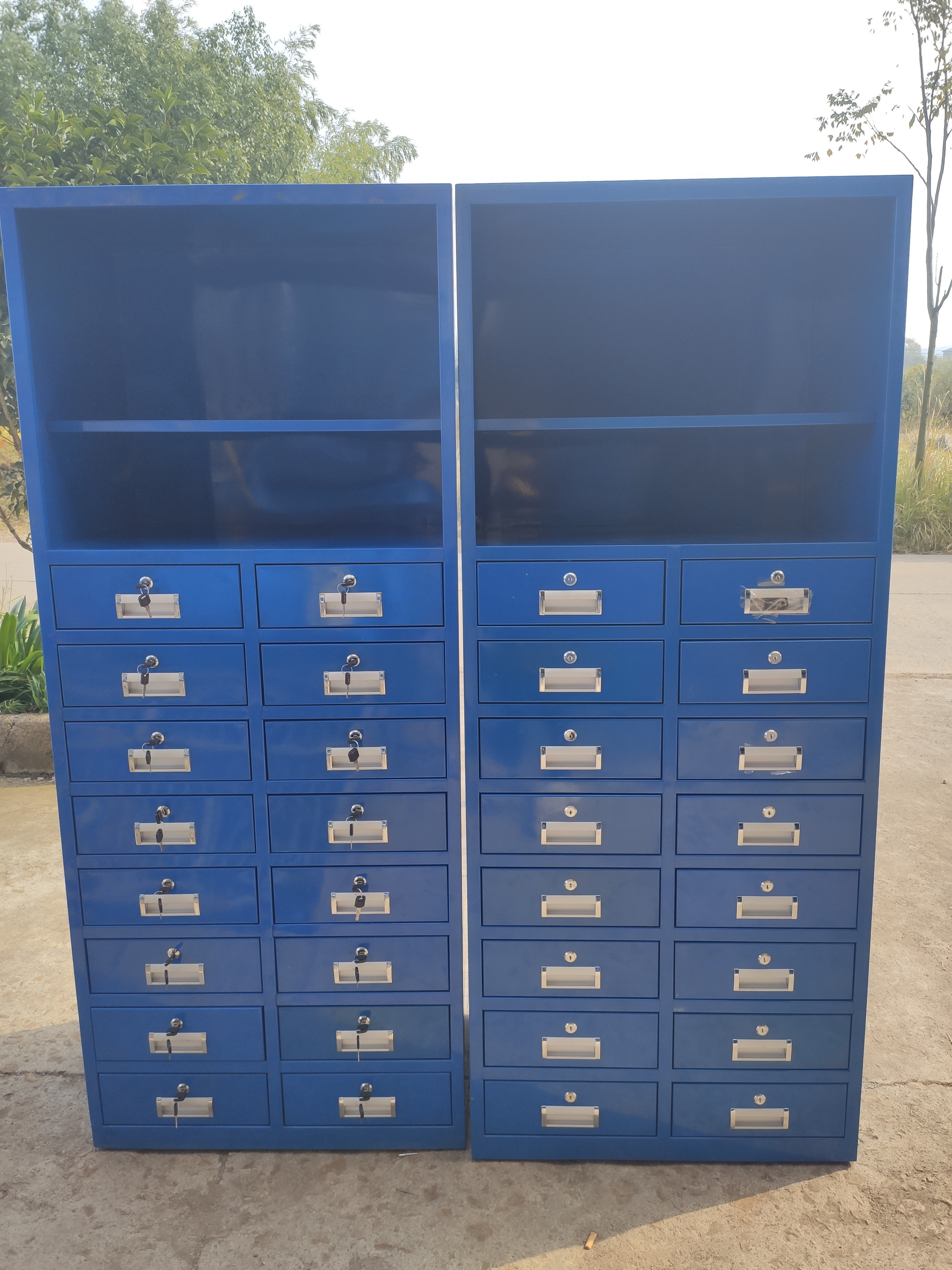 Metal tool cabinet with hook board used for workshop staff lockers