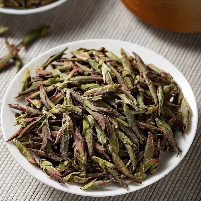 Wholesale popular tea  Yunnan ancient trees  Fragrance of flowers and honey Pu'er raw tea with purple spores