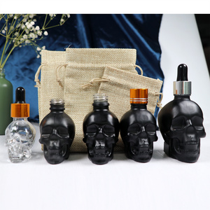 fancy perfume 15ml 30ml 60ml China supplier skull head shape glass skull 1oz glass beard oil dropper bottle for Wine container