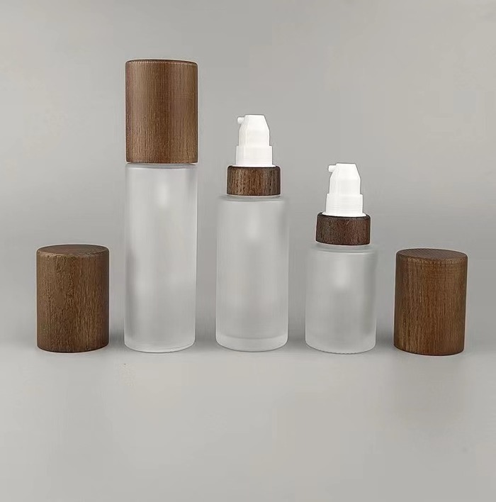 Wholesale 30g 50g 100g 150g2 00g 250g amber frosted bamboo glass bottles only bamboo lids bamboo lotion spray pump cap