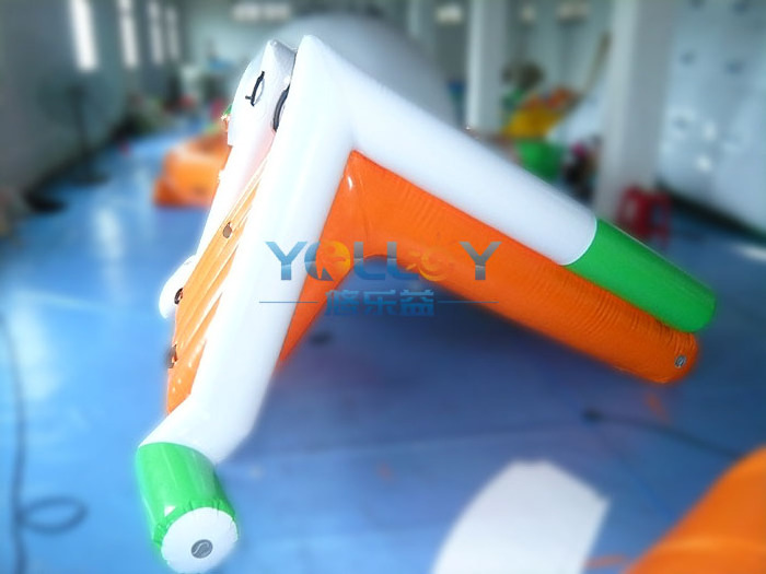 Floating water trampoline park with totter teeter and other single single water toys