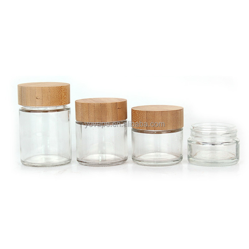 Eco-friendly hot sale 50ml 60ml 90ml 110ml 2 ounce 3 Oz 4Oz round food spice cookie storage clear glass jar with bamboo wood lid