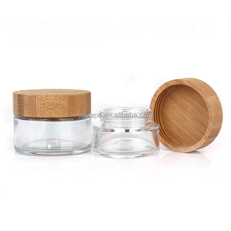 Eco-friendly hot sale 50ml 60ml 90ml 110ml 2 ounce 3 Oz 4Oz round food spice cookie storage clear glass jar with bamboo wood lid