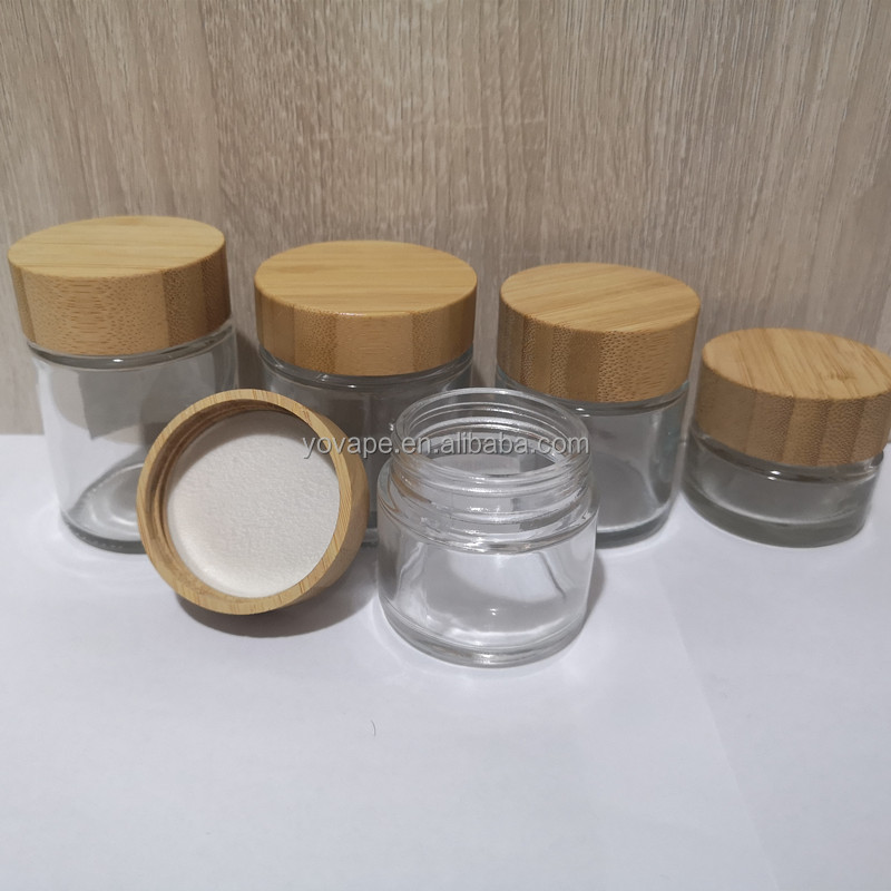 Eco-friendly hot sale 50ml 60ml 90ml 110ml 2 ounce 3 Oz 4Oz round food spice cookie storage clear glass jar with bamboo wood lid