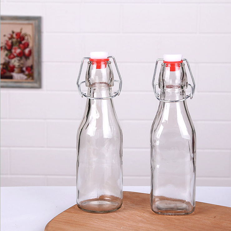 hot selling Factory Price 250ml 500ml 1000ml Empty Clear Drinking Beverage Swing Top Lid Glass Bottle