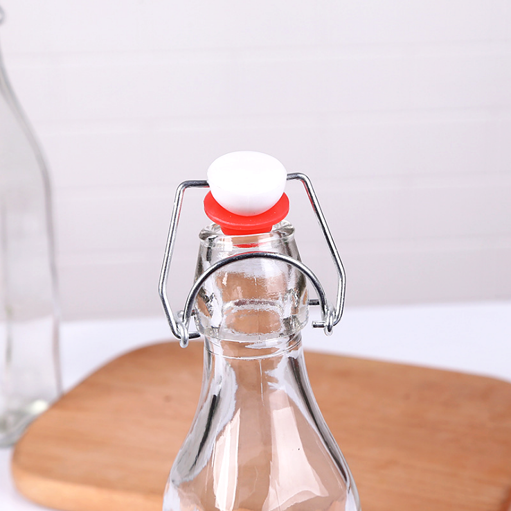 hot selling Factory Price 250ml 500ml 1000ml Empty Clear Drinking Beverage Swing Top Lid Glass Bottle