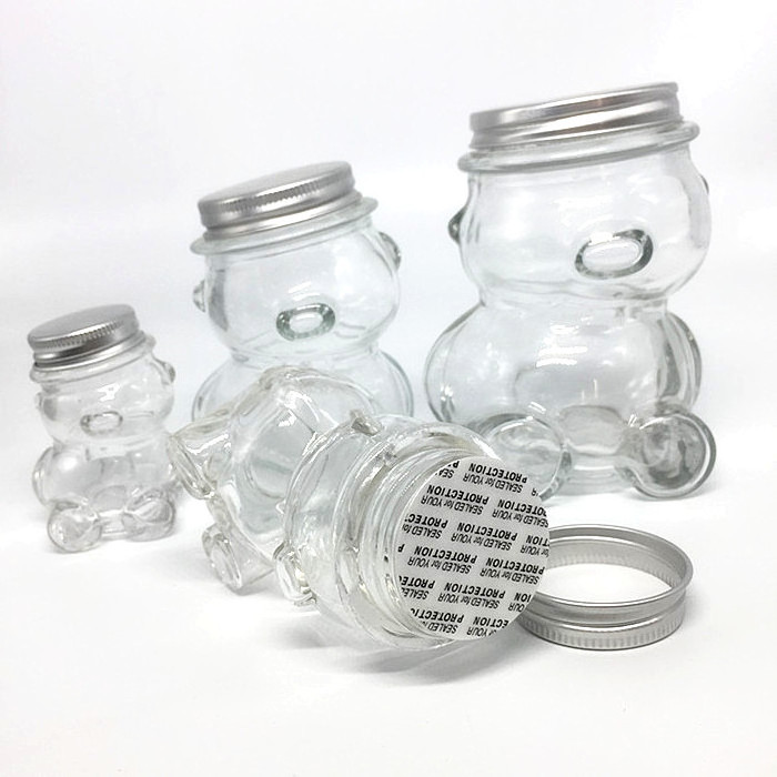 wholesale cheap 50ml 100ml teddy bear shaped frosco vidrio glass bottle honey bee candy sugar chocolate glass jar with lug lid