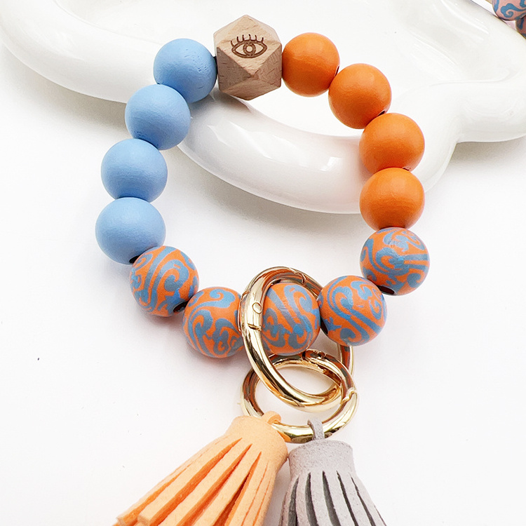 Fashionable and Popular Multipurpose Wooden Beaded Bracelet  Korean Velvet Tassel Keychain Devil's Eye Butterfly LOVE