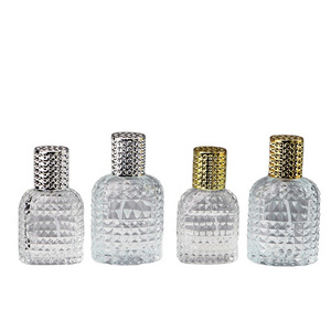 Wholesale 30ml 50ml grenade shape  thickened clear glass perfume bottle with aluminum screw cap and insert for sale